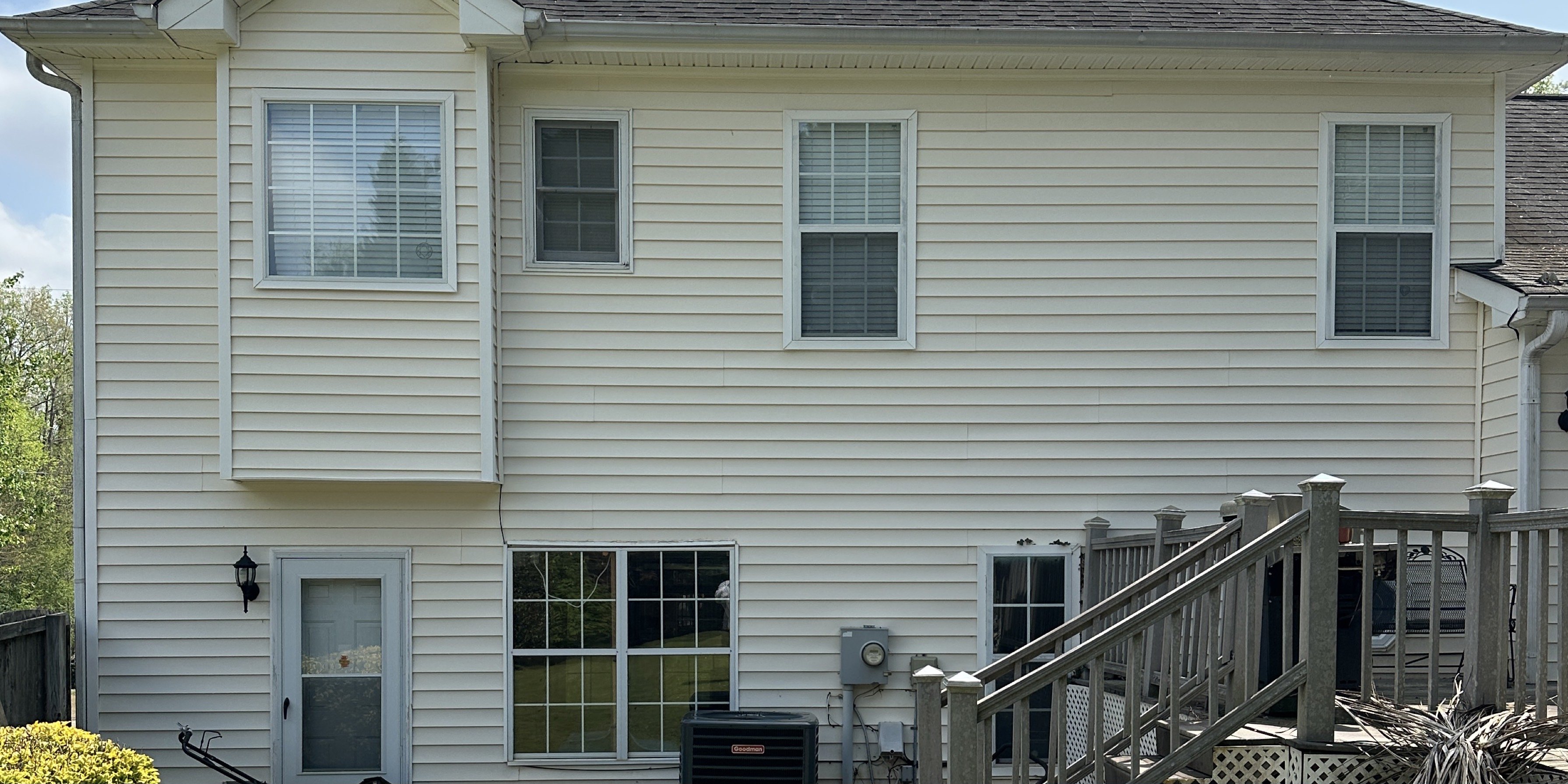Clean white siding on a home after professional house washing